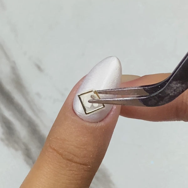 Applying Rendezvous nail embellishments